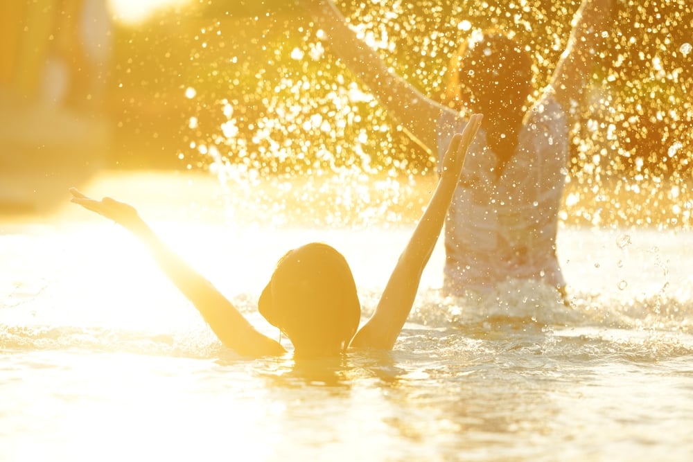 Happy children playing on hot summertime